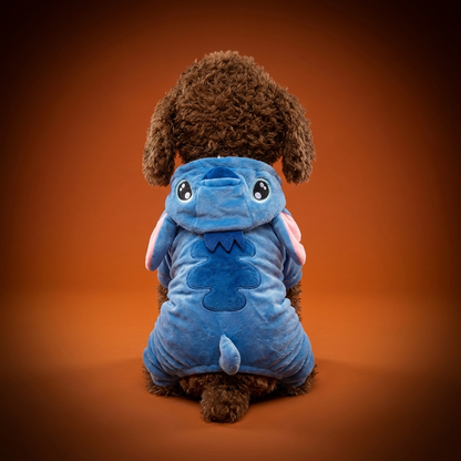 Blue Alien Suit dog costume on branded orange studio backdrop
